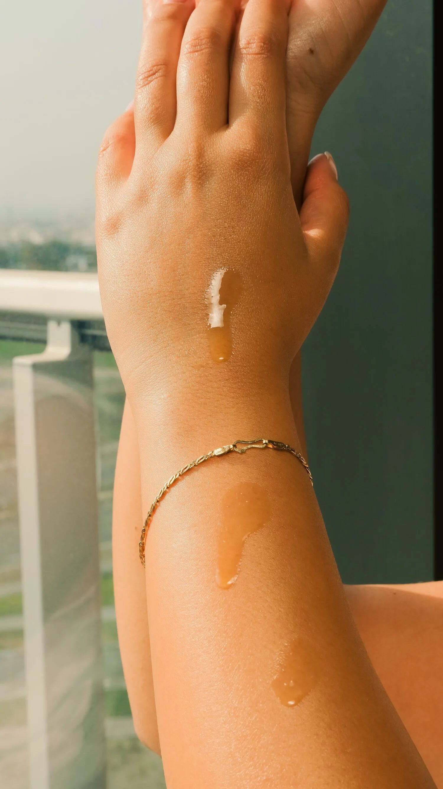 Olive oil glistening on sunlit skin